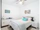 The nautical themed bedroom has a ceiling fan and carpet at 14204 Heritage Landing Blvd # 714, Punta Gorda, FL 33955