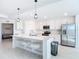Stylish kitchen with a large island, stainless steel appliances, and plenty of storage space at 14204 Heritage Landing Blvd # 714, Punta Gorda, FL 33955