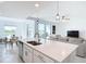 Bright open-plan living room with modern island kitchen, dining area, and stylish contemporary furniture at 14204 Heritage Landing Blvd # 714, Punta Gorda, FL 33955