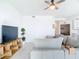 Bright living room features tile floors and a modern ceiling fan at 14204 Heritage Landing Blvd # 714, Punta Gorda, FL 33955