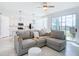 Open-concept living area flowing into a kitchen, featuring sleek design, comfortable sofa, and abundant natural light at 14204 Heritage Landing Blvd # 714, Punta Gorda, FL 33955