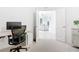 A home office with modern desk, chair and white accents at 14204 Heritage Landing Blvd # 714, Punta Gorda, FL 33955