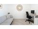 This home office has a modern desk, chair and loveseat at 14204 Heritage Landing Blvd # 714, Punta Gorda, FL 33955