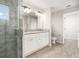 Spacious bathroom featuring a double vanity with granite countertop and tiled walk-in shower at 3067 Newbury St, Port Charlotte, FL 33952