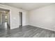 Bedroom features gray wood-look flooring and a sliding door closet at 3067 Newbury St, Port Charlotte, FL 33952