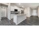 Modern kitchen with granite countertops, stainless steel appliances, and a kitchen island at 3067 Newbury St, Port Charlotte, FL 33952
