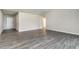 Spacious living room featuring gray wood flooring and neutral walls at 3067 Newbury St, Port Charlotte, FL 33952