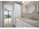 Well-lit bathroom featuring a dual vanity sink and balcony access through an ensuite at 3211 W Swann Ave # 808, Tampa, FL 33609