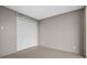 Neutral bedroom featuring a double door closet and light tile flooring at 3211 W Swann Ave # 808, Tampa, FL 33609