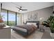 Comfortable main bedroom with a king bed, balcony access, and bright natural lighting at 3211 W Swann Ave # 808, Tampa, FL 33609