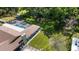 Aerial shot of the home showcasing the backyard with a screened-in pool and patio area at 4301 Hudson Ln, Tampa, FL 33618