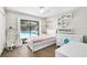 bedroom with a pool view from the large window and white furnishings at 4301 Hudson Ln, Tampa, FL 33618