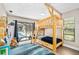 bedroom featuring a wooden bunk bed with a slide and a pool view at 4301 Hudson Ln, Tampa, FL 33618