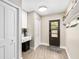 Inviting entryway with laminate floors, a convenient built-in desk, and a well-placed mudroom at 4301 Hudson Ln, Tampa, FL 33618