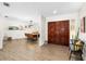 Warm and inviting entryway boasting wood floors, double doors, and open view of the dining area at 4301 Hudson Ln, Tampa, FL 33618