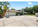 Home exterior with a spacious driveway and a two-car garage at 4301 Hudson Ln, Tampa, FL 33618