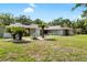 Beautiful single-story home featuring mature landscaping and lush lawn, providing great curb appeal in a quiet neighborhood at 4301 Hudson Ln, Tampa, FL 33618