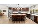 Gourmet kitchen featuring stainless steel appliances, large island with bar stool seating, and custom cabinetry at 4301 Hudson Ln, Tampa, FL 33618