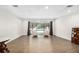 Bright living room with hardwood floors, leading to a screened-in patio and pool at 4301 Hudson Ln, Tampa, FL 33618