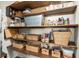 Well-organized pantry with wooden shelves and various storage containers for kitchen essentials at 4301 Hudson Ln, Tampa, FL 33618