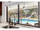 Enjoy backyard views of a screened pool with a water slide from the kitchen window at 4301 Hudson Ln, Tampa, FL 33618