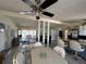 Spacious living area with a kitchen island, dining area, and seamless flow, great for entertaining guests at 29146 Tamayo Dr, Punta Gorda, FL 33982