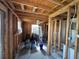 Renovation progress of a room with exposed framing, wiring, and windows for natural light at 29146 Tamayo Dr, Punta Gorda, FL 33982