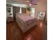Bedroom with hardwood floors, a decorative ceiling fan, and furnishings at 3124 Pond Hollow St # 183, Wesley Chapel, FL 33543