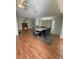 Open dining room with wood floors, a marble table, and access to other rooms and the kitchen at 3124 Pond Hollow St # 183, Wesley Chapel, FL 33543