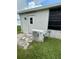 Exterior A/C unit located on a concrete slab near a door to a room in the home at 3124 Pond Hollow St # 183, Wesley Chapel, FL 33543