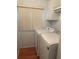 Cozy laundry area with a washer, dryer, and storage shelf for efficiently handling household chores at 3124 Pond Hollow St # 183, Wesley Chapel, FL 33543