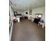 Open sunroom-style living room with bright windows, neutral tones and a comfortable and inviting space at 3124 Pond Hollow St # 183, Wesley Chapel, FL 33543