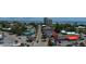 An aerial view displays colorful buildings and the beautiful coastline with oceanfront condos in the background at 5169 Oxford Dr, Sarasota, FL 34242