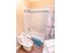 Full bathroom with shower and tub combo, seashells design at 5169 Oxford Dr, Sarasota, FL 34242