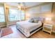 The main bedroom has neutral tones and large windows with plantation shutters at 5169 Oxford Dr, Sarasota, FL 34242