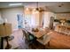 Dining Area with wood floors, a dining table, and a view of the kitchen at 5169 Oxford Dr, Sarasota, FL 34242