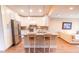 Modern kitchen with white cabinets, stainless steel appliances, and an island with bar seating at 5169 Oxford Dr, Sarasota, FL 34242