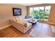 Cozy living room with a large window offering lots of light, wood floors, and comfortable seating at 5169 Oxford Dr, Sarasota, FL 34242