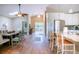 Open-concept living space featuring wood floors, a dining area, and a modern kitchen at 5169 Oxford Dr, Sarasota, FL 34242