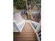 Exterior staircase leading up to a well-maintained home with lovely landscaping at 5169 Oxford Dr, Sarasota, FL 34242