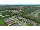 An expansive neighborhood with mature trees and landscaping, showcasing homes nestled within a serene natural environment at 7114 Mill Hopper Ct, Palmetto, FL 34221