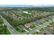 An aerial view of a residential neighborhood, highlighting the community's proximity to natural ponds and spacious backyards at 7114 Mill Hopper Ct, Palmetto, FL 34221