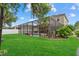 Spacious backyard with screened-in pool and lounging area at 7114 Mill Hopper Ct, Palmetto, FL 34221