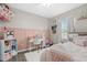Bright bedroom features a desk area, a window and plush decor at 7114 Mill Hopper Ct, Palmetto, FL 34221