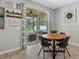 Cozy dining area with sliding glass doors leading to the outdoor patio and backyard at 7114 Mill Hopper Ct, Palmetto, FL 34221