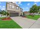 This home features a well-maintained lawn, beautiful landscaping, and stone accents at 7114 Mill Hopper Ct, Palmetto, FL 34221