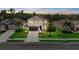 Beautiful two-story home with stone accents, a well-manicured lawn, and lush landscaping at 7114 Mill Hopper Ct, Palmetto, FL 34221