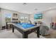Spacious game room with a pool table, entertainment center, and comfortable seating, great for Gathering fun at 7114 Mill Hopper Ct, Palmetto, FL 34221