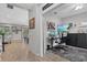Inviting home office space with modern monitors and decor; adjacent to spacious living area at 7114 Mill Hopper Ct, Palmetto, FL 34221