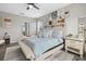 Relaxing primary suite featuring plush bedding, stylish decor, and abundant natural light at 7114 Mill Hopper Ct, Palmetto, FL 34221